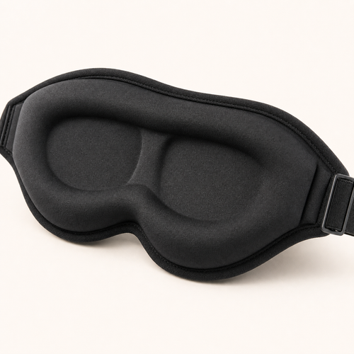 Close-up of the moulded eye domes, stitched edge and adjustable strap slider